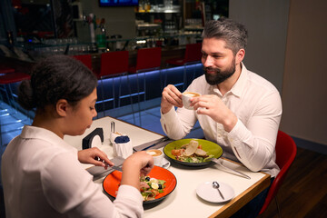 Romantic man having dinner with his girlfriend