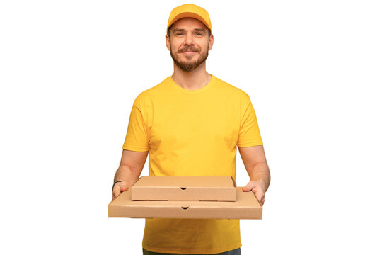 Portrait of young delivery man in yellow uniform with pizza boxes isolated over transparent background