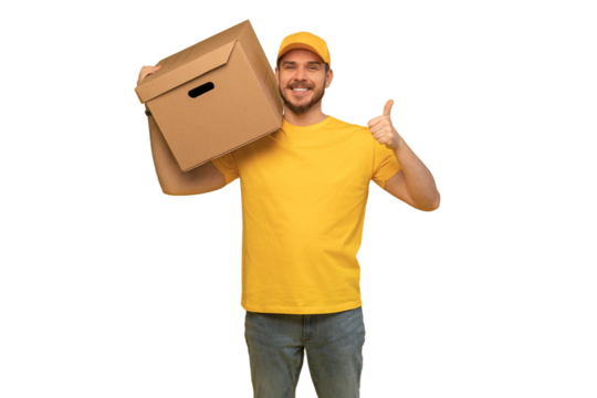 Portrait of excited delivery man in yellow uniform holding paper box isolated over transparent background