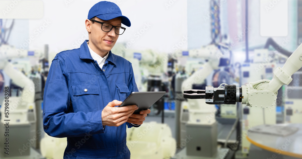 Poster Engineer uses a digital tablet to control robots in a smart factory. Smart industry 4.0 concept	