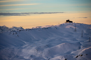 Sunset with a view of the Crap Masegn gondola station in the ski resort of Flims Laax.
Winter in...