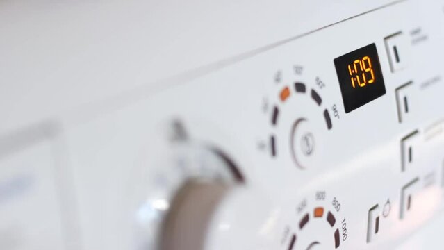 Turning on the washing machine close-up. Dashboard of the washing machine. selective focus