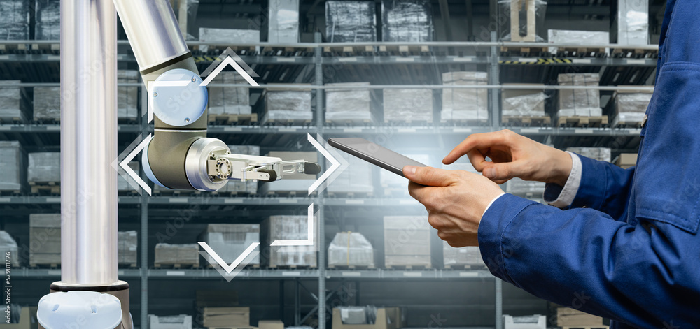 Aufkleber warehouse manager with digital tablet controls robot arm