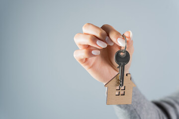 Woman holding house keys in her hand