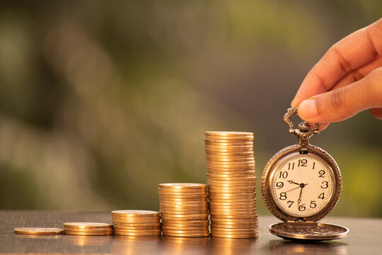 Coin Stack With Watch, Loan Repayment Time Limit Or Time Is Money Concept