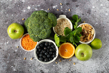 Food sources of omega-3 on a dark background. Foods high in fatty acids, including vegetables, nuts, and seeds.