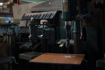 Part machining with drilling machine