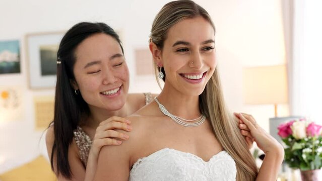 Wedding, bride and bridesmaid looking happy, proud and excited share hug, joy and love wearing white dress and ready for ceremony. Interacial asian woman and friend laughing waiting for a celebration
