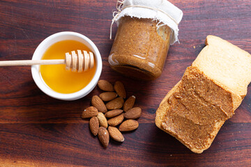 honey and almonds, Delectable Amlu Spread on Toasted Bread with Nutty Almonds and Sweet Honey