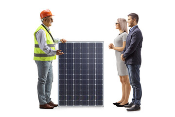 Male engineer talking about a solar panel with a couple