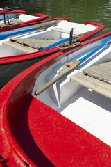 A blue painted fiberglass fishing boat hauled dry in the middle of an estuary at sunrise
