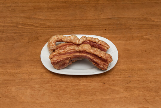 A torrezno is a strip of bacon, always with the skin on, fried or saut&eacute;ed in a pan or toasted on the grill. the torreznos are crispy and golden on the skin side. They are usually eaten as a tapa