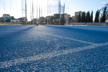 athletics flooring in front of a hammer throw field in a sports hall