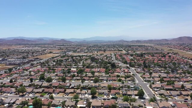 Aerial view of a sprawling neighborhood of family homes in Menifee, California, USA.