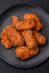 Delicious crispy breaded chicken wings grilled with spices and herbs