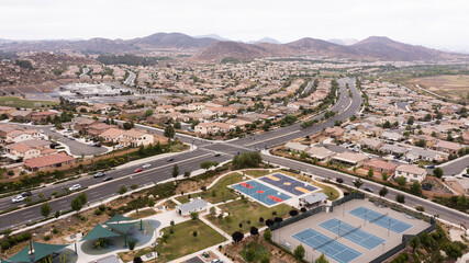 Fototapeta premium Aerial view of a sprawling neighborhood of family homes in Menifee, California, USA.