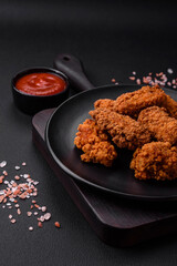 Delicious crispy breaded chicken wings grilled with spices and herbs