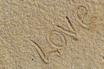 love message written in sand, background for design