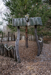 the territory fenced with a palisade of sharpened logs with fortified animal skulls serves as a place of ritual communication
