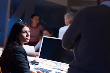 Group of web designers developing a cybersecurity website, app or software late at night in the office