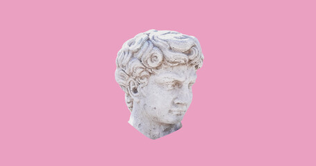 Close up of ancient sculpture male head and copy space on pink background