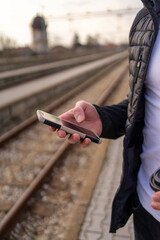 Close-up photo of the man texting on the phone 