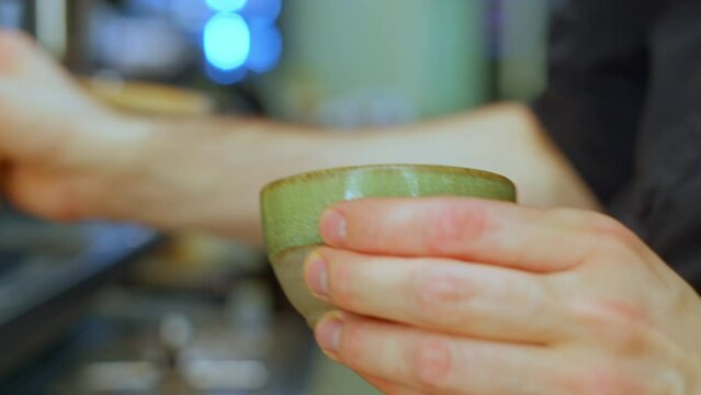 Barist making flat white coffee in cafe shop. Close-up video.