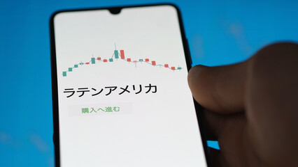 Investor analyzing an ETF. Funds stocks exchange ETFs Japanese text: latin america, buy. ラテンアメリカ 証券取引所 投資 shares