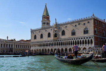 Fototapeta na wymiar Venice, Italy - Gondoliers near Doge's palace and St Mark's Campanile