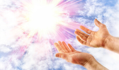 Religious hands outstretched to heaven offering themselves to God