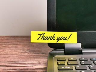 Thank you note stick on laptop.