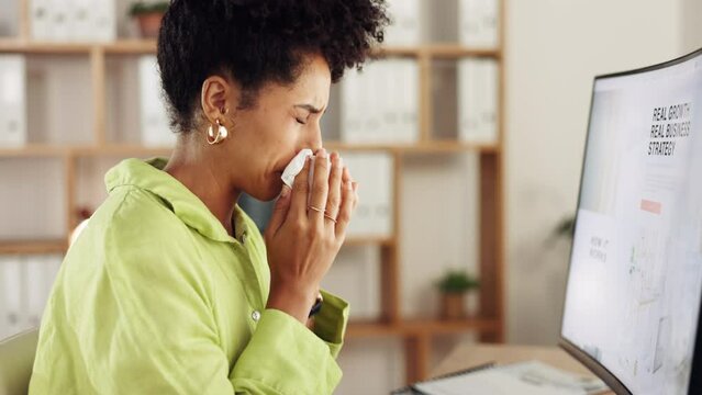 Woman, tissue and blowing nose in business for allergies, sickness and cold virus at night. Sick female employee, flu and sneeze from allergy, health risk and medical sinusitis disease at computer