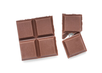 Pieces of delicious milk chocolate bars on white background, top view