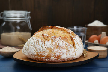 Freshly baked bread on blue wooden table