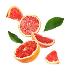 Cut fresh grapefruit and green leaves flying on white background