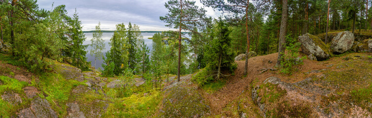 Beautiful blue lake and pine forest, Park Mon Repos, Vyborg, Russia