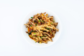 A plate of spicy chicken feet on a white background