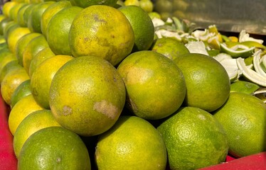 A close-up of fresh green lemons