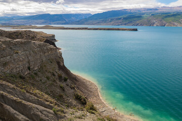 On the mountain shore of the Chirkey reservoir on a sunny September day. The Republic of Dagestan. Russia