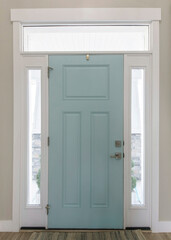 Vertical Mint front door interior with transom window and sidelights