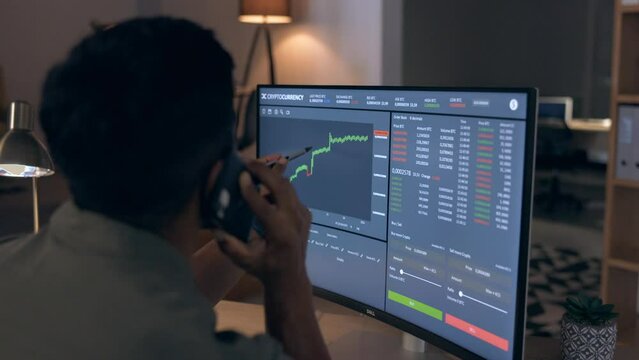 Computer screen, cryptocurrency and stock market with man and phone call about stats, forex growth and graph. Communication, trader check investment stocks and finance, charts and working night