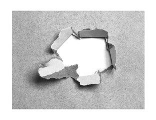 ripped hole paper on white background and have copy space for design in your work.