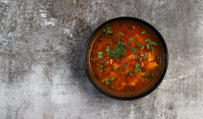 Borscht - beetroot soup in a bowl on a dark background. Top view, flat lay