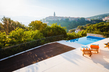 Stunning infinity swimming pool at dawn in a luxury hotel in Vrbnik.