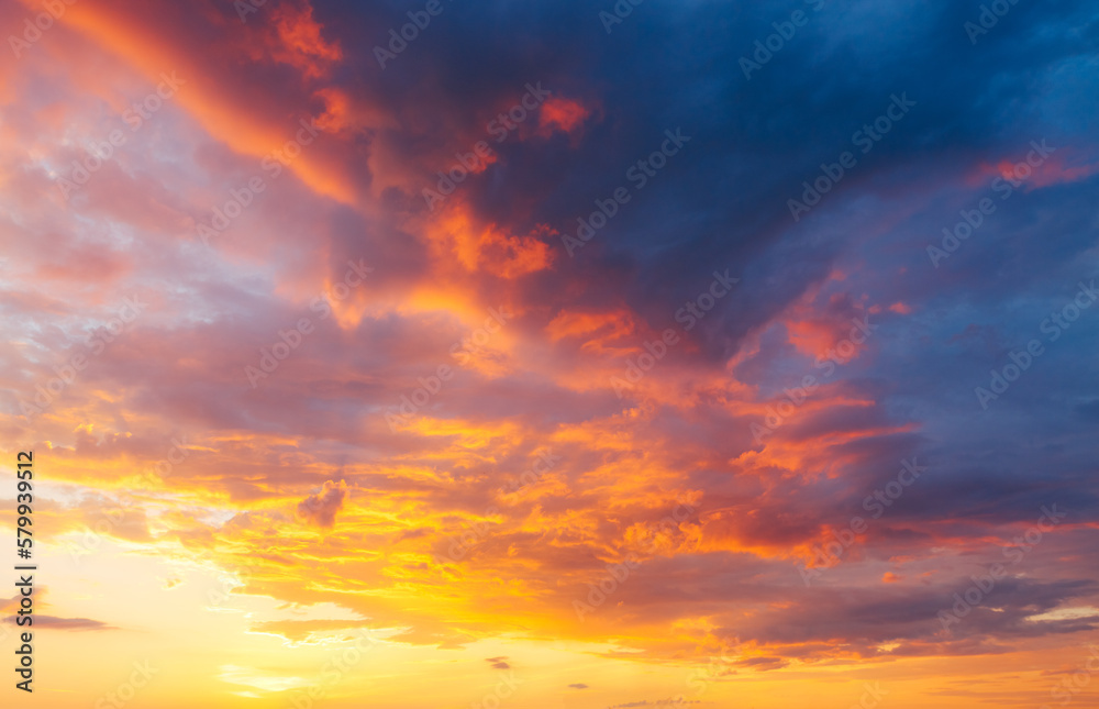 Poster utterly spectacular sunset with colorful clouds lit by the sun. bright epic sky.