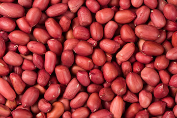 red peeled peanuts texture background.
