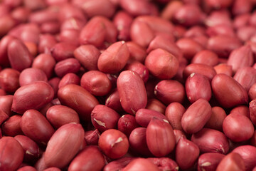 red peeled peanuts texture background.