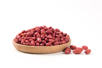 red peeled peanuts in wooden plate isolated on white background.