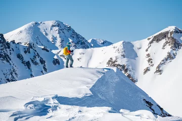 Rolgordijnen Mountaineer backcountry ski walking ski alpinist in the mountains. Ski touring in alpine landscape with snowy trees. Adventure winter sport. Tatras, slovakia © alexanderuhrin