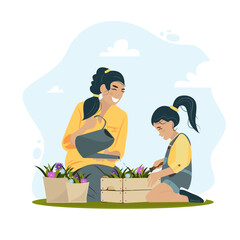 Young mother and daughter planting flowers outside. Eco environment care. Earth Day.Parenting.Family spring activity. Gardening discovering and teaching. Mom and daughter happy to spend time